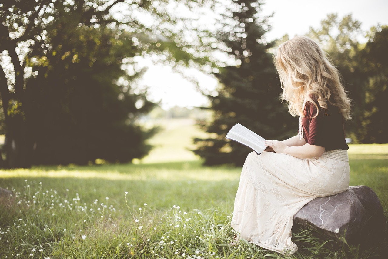 Woman reading peacefully in nature