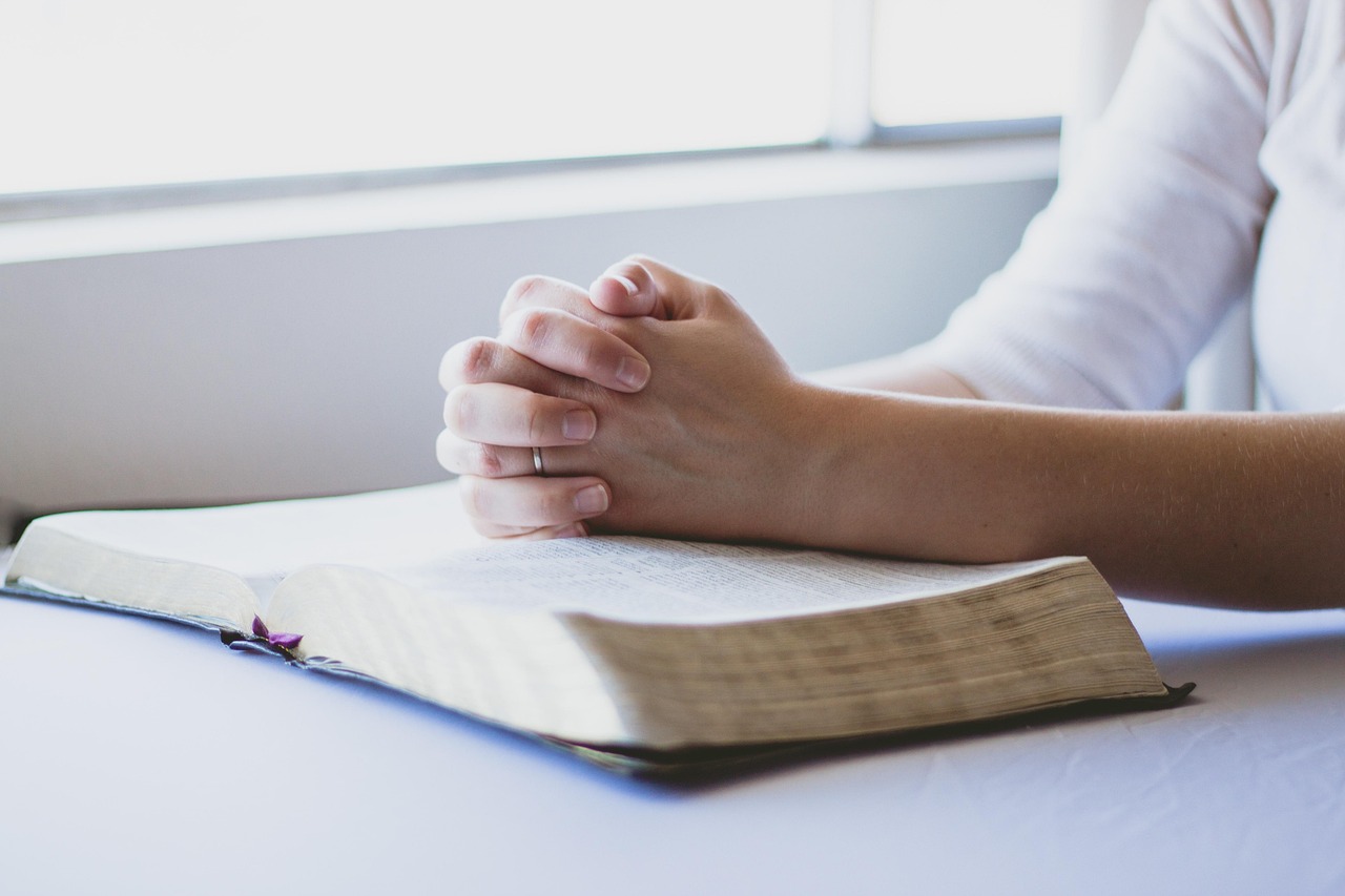 Woman in prayer seeking God's guidance